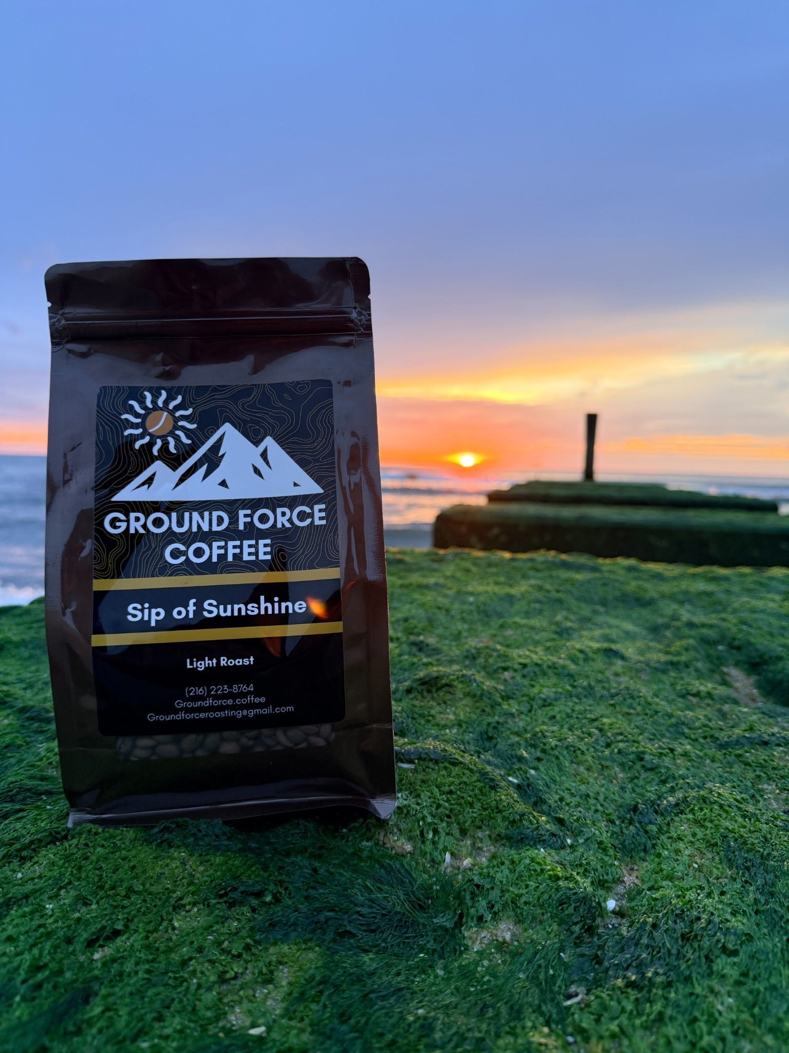 Sip of Sunshine coffee bag at sunrise by the ocean